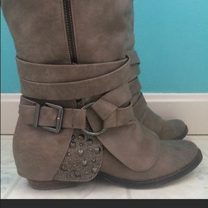 Buckle knee-high boots.